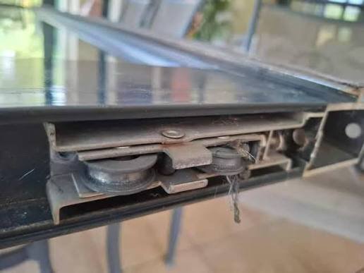 Worn sliding door roller
